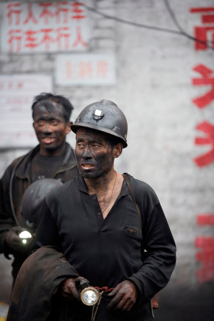 Chinese coal miner. China mines 4 billion tons of coal each year, half of the world’s total. Besides contributing to climate change, air pollution from coal burning kills roughly 0.5 to 1 million people in China each year. Photograph by Natalie Behring / Alamy.